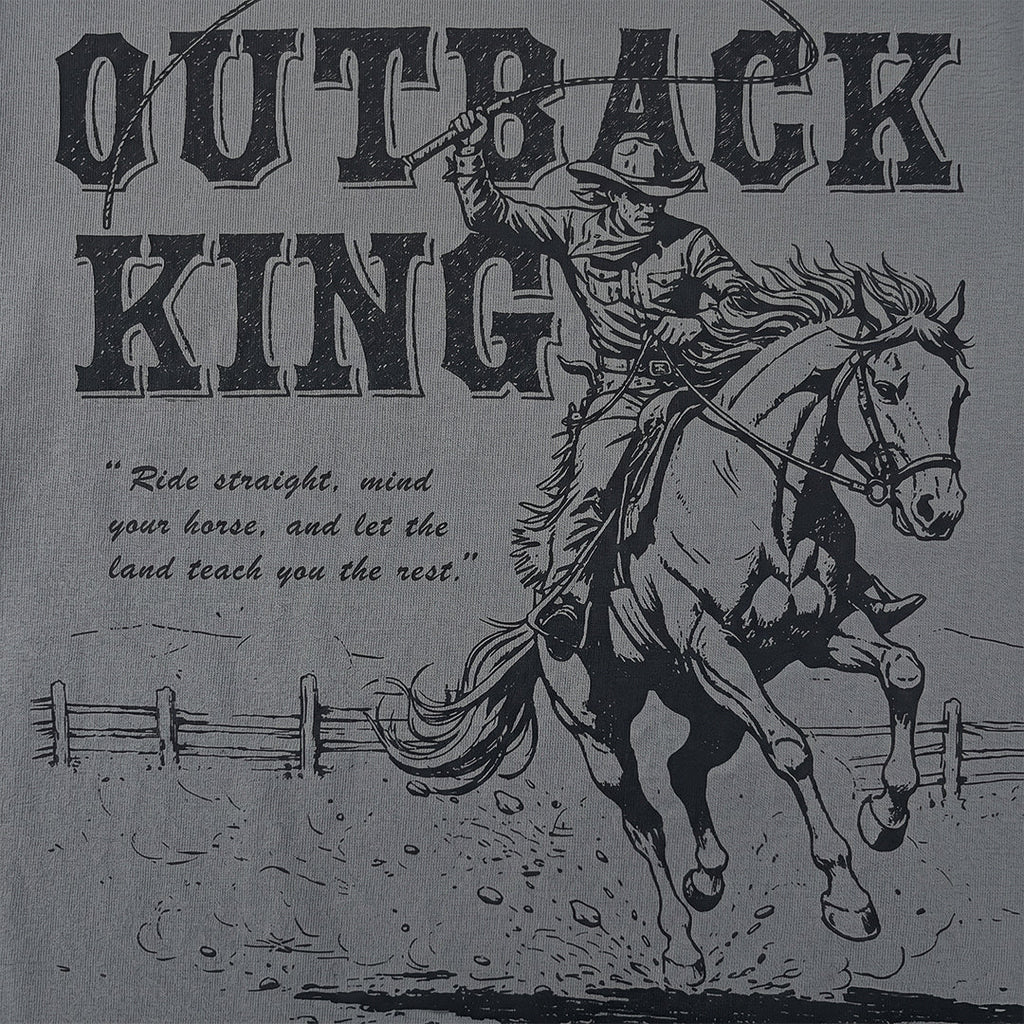 Vintage-style graphic of a cowboy on horseback with text 'Outback King' and a quote.