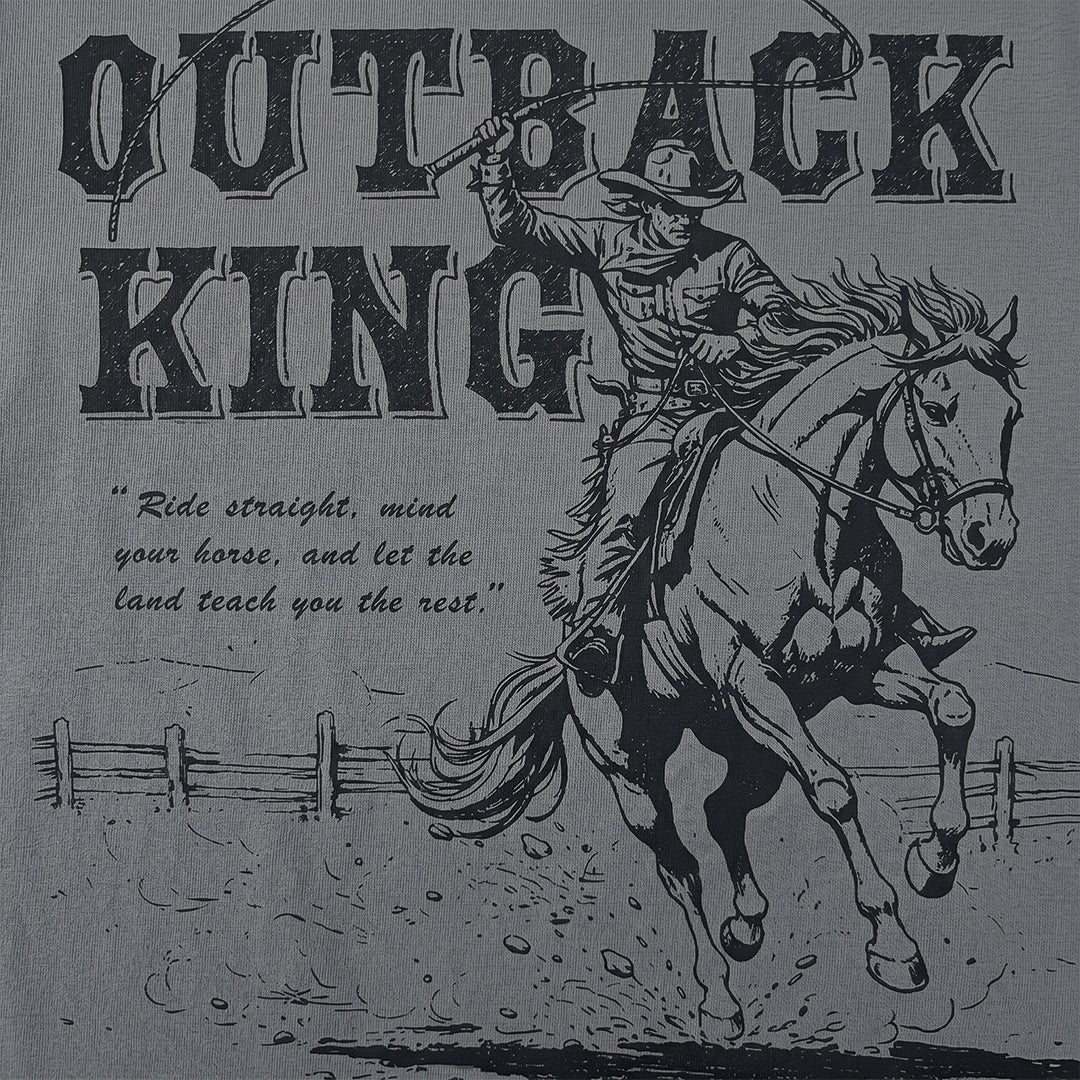 Vintage-style graphic of a cowboy on horseback with text 'Outback King' and a quote.